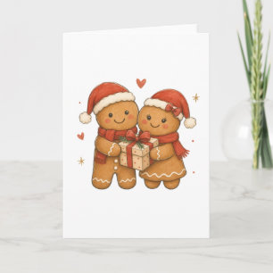 Ingwerbrot-Paar mit Geschenk und Weihnachtsmannmüt Karte