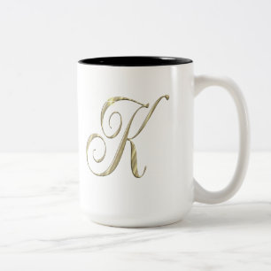 Initialenwaren des Goldmonogramms K Zweifarbige Tasse