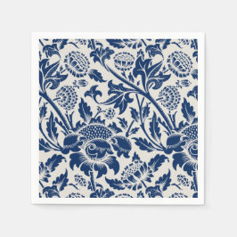 Intricate blue floral pattern on light background serviette
