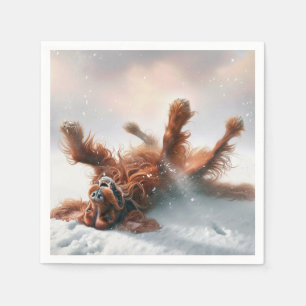 Irischer Setter rollt im Schnee Serviette