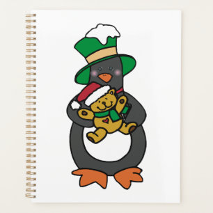 Irish Penguin hält Weihnachts-Teddybär Planer