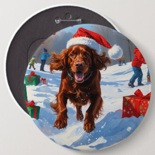 Irish Red Setter läuft durch Schnee mit Weihnachts Button