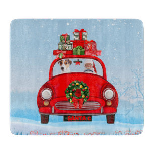 Jack Russell fährt mit dem Weihnachtsmann in Auto Schneidebrett