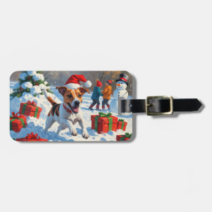 Jack Russell läuft im Schnee mit Weihnachtsmütze Gepäckanhänger