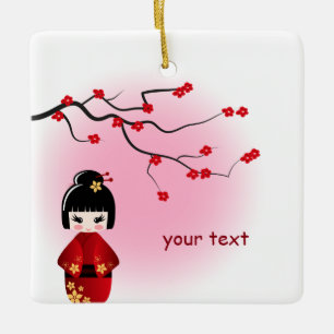 Japanische kokeshi Puppe in Kirschblüte blüht Keramikornament