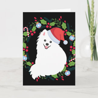 Japanischer Spitz-Hund im Weihnachtskranz Karte