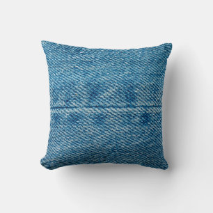 Jeans Nahaufnahme Hintergrund. Denim-Nähte. Blaues Kissen