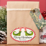 Jolly Christmas Elf Legs Stripes Holiday OVAL Ovaler Aufkleber<br><div class="desc">Die OVAL Aufkleber sind wunderschön für Gastgeschenke,  Geschenke,  Einladungen,  hausgemachte Geschenke und vieles mehr. Sie tragen rote und elfenbeingestreifte Strumpfhosen und grüne Stiefel mit Glocken und Ihre Weihnachtsdetails in schicker Schrift. ***ALLE SHAPES sind bereits für Sie in unserem Shop fertig und sehen die MATCHING-Artikel in der Sammlung.</div>
