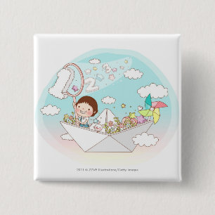 Junge, der im Papierboot sitzt Button