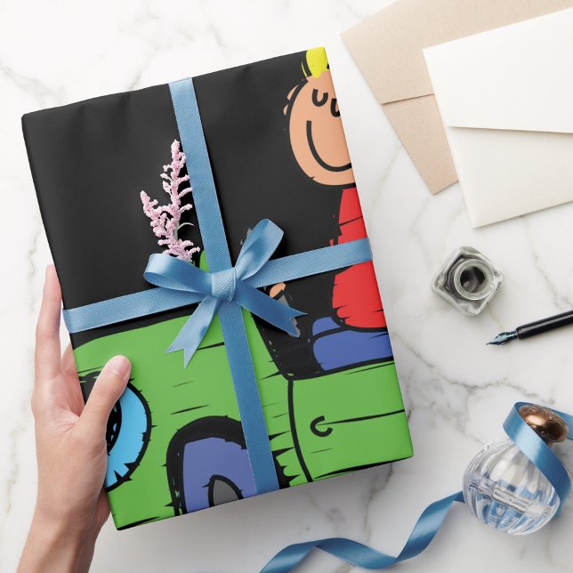 Junge in einem grünen Karren-Papier Geschenkpapier (Von Creator hochgeladen)