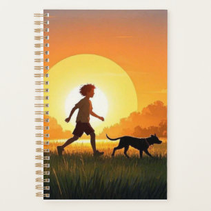 Junge Junge mit Hund bei Sonnenuntergang Planer