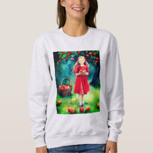 Junge Mädchen in einem Apfelgarten Sweatshirt