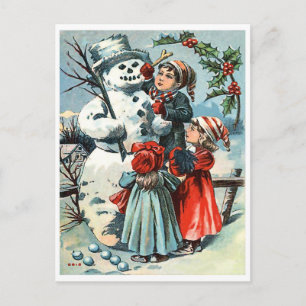 Junge und zwei Mädchen beim Schneemannbauen, alte Postkarte
