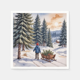 Junge zieht einen Schlitten mit Weihnachts-Tannenä Serviette