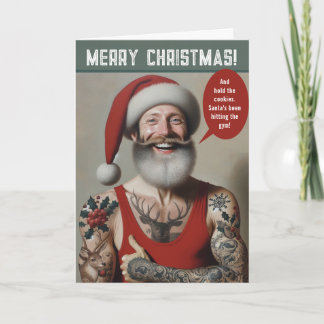 Junger, muskulöser Weihnachtsmann mit Tätowierunge Feiertagskarte