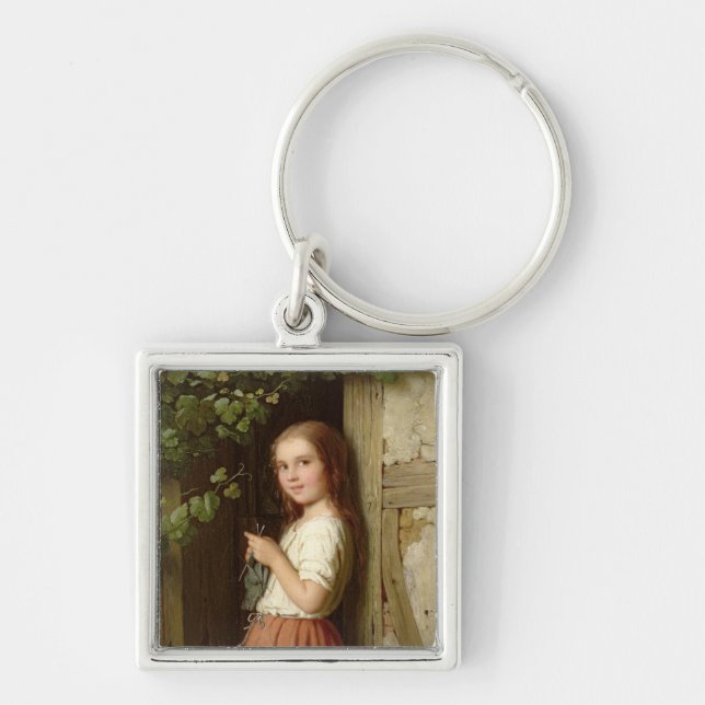 Junges Mädchen stehend in einem strickenden Schlüsselanhänger (Vorne)