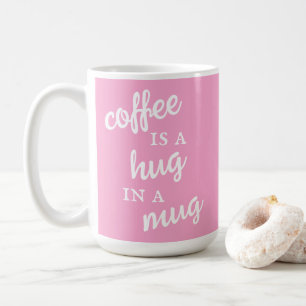 Kaffee ist ein Umarmer in einer Tasse Rosa Tasse