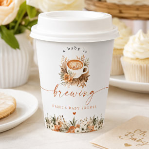 Kaffeebaby-Shower-Tischdekoration, Ein Baby ist am Pappbecher