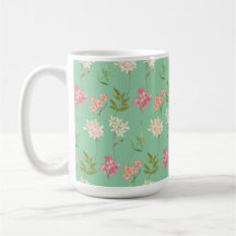 Kaffeemaschine mit Blumenmotiv im grünen Hintergru