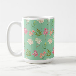 Kaffeemaschine mit Blumenmotiv im grünen Hintergru Kaffeetasse