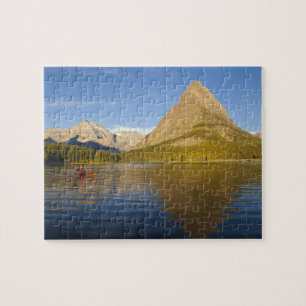 Kajak im Swiftcurrent Lake bei Sonnenaufgang Puzzle