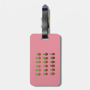 Kaktus auf rosa Gepäckanhänger