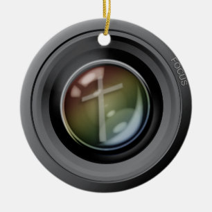 Kameraobjektiv-Verzierung. Fokus auf Jesus Keramik Ornament