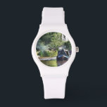 KANAL ARMBANDUHR<br><div class="desc">Die im Vereinigten Königreich als Schmalboote bekannten Kanalboote wurden ursprünglich zur Beförderung von Gütern im ganzen Land eingesetzt. Sie werden heute hauptsächlich zur Freizeitgestaltung genutzt und ziehen Menschen aus aller Welt an, um unsere ländliche Umgebung zu genießen. Diese Boote sehen sehr hübsch mit ihren hellen Kabinen aus, die traditionell blau,...</div>