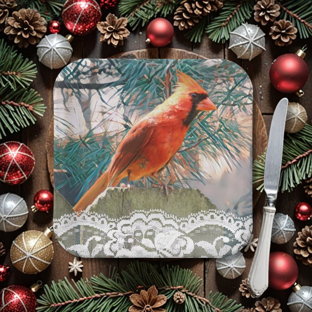 Kardinal vor dem Kiefernwald Winter Pappteller (A handsome red bird (northern cardinal) sits before a pine. Lace adds an elegant touch to your plate)