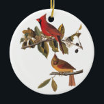Kardinalgrosbeak-Vögel Vintages Audubon Keramik Ornament<br><div class="desc">Dieses Paar Kardinal Grosbeakvögel wird in einem wilden Mandelbaum gehockt.  Der männliche Vogel ist ein helles Rotes und und die Frau ist eine goldene Farbe mit roten Markierungen. Dieses ist Buchzeichen 159 von Vögeln Johns James Audubons von Amerika. Die perfekte Weihnachtsverzierung für irgendeinen Vogelliebhaber.</div>