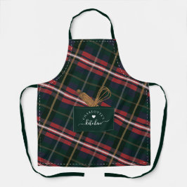 Kariertes Fake mit rotem Grün und Holzlöffel Schürze