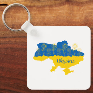 Karte der Ukraine mit Sonnenblumen und ukrainische Schlüsselanhänger