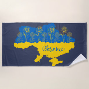 Karte der Ukraine mit Sonnenblumen und ukrainische Strandtuch