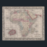 Karte von Afrika mit St. Helena Puzzle<br><div class="desc">Eine herrliche Vintage Karte mit decoratve Grenze,  die den Kontinent von Afrika mit einer Einfügung der Insel von St. Helena zeigt. Bedeckt den Kontinent ausführlich beträchtliches das Niveau,  zu dem es zu der Zeit erforscht wurde,  circa 1864 betrachtend.  © Bridgeman Bilder</div>