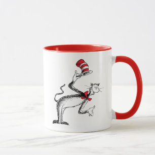 Katze im Hut nimmt einen Bow Tasse