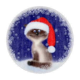 Katze in Weihnachtsmannmütze Schneidebrett