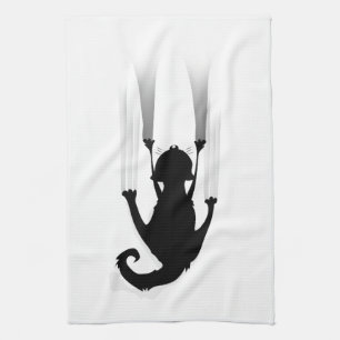 Katze klettert geschirrtuch