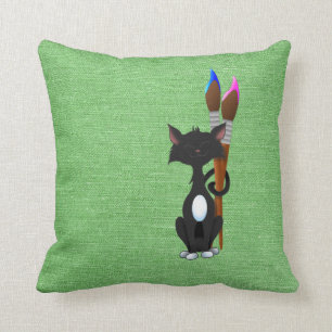 Katze mit Pinsel auf Grün Kissen