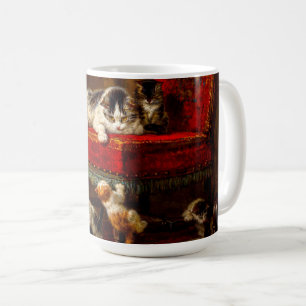 Katze und Kätzchen spielen mit Stuhl Kaffeetasse