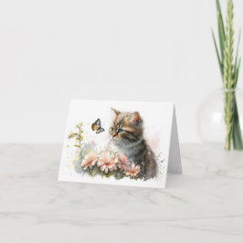 Katze und Schmetterling im Garten