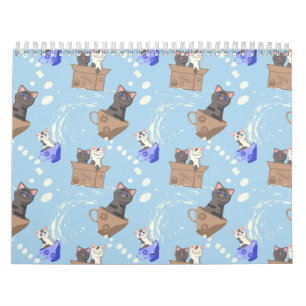 Katzen in Kiste und Milchfallen auf blau Kalender