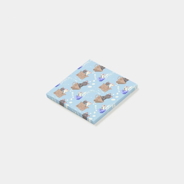 Katzen in Kiste und Milchfallen auf blau Post-it Klebezettel (angewinkelt)