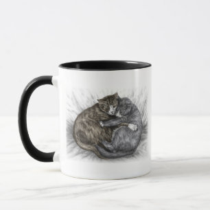 Katzen schlafen tasse