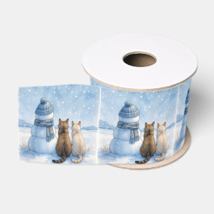 Katzensitzend mit einem Schneemann auf einem Feld Ripsband