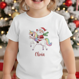 Kawaii Weihnachtsmann reitet auf einem Regenbogen- Baby T-shirt