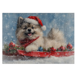 Keeshond Hund in Sledge Lass es Schnee Weihnachten Schneidebrett