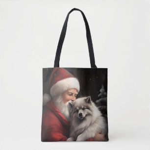 Keeshond mit Weihnachtsmann Festives Weihnachten