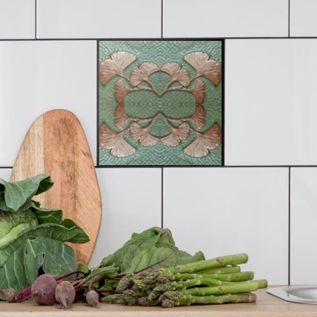 Keramik Gingko Tile Fliese (Single Green and copper Gingko leaf tile shown with white tiles in a kitchen.)