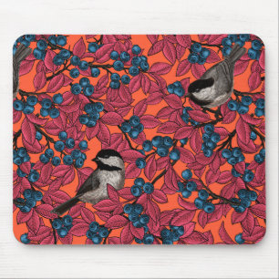 Kichervögel auf Blaubeeren-Ästen auf Orange Mousepad
