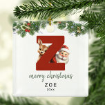 Kids Letter Z Monogram Christmas Tree Ornament Aus Metall<br><div class="desc">Geben Sie Ihrem Weihnachtsbaum eine persönliche Touch in dieser Weihnachtszeit mit einem Monogramm Ornament! Mit Santa und einem Rentier, der hinter dem Buchstaben Z schaut, kann dieses Ornament mit einem Sonderfoto, Namen und Jahr personalisiert werden, und einem beiliegenden Template Gruß. Machen Sie diesen festlichen Sake zu einem Teil Ihrer traditionellen...</div>